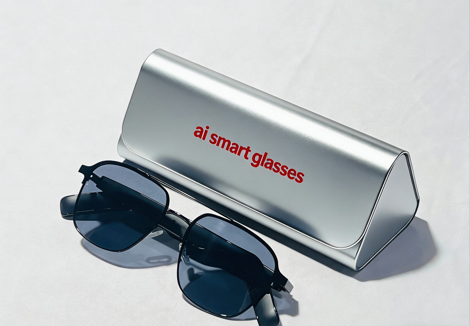AI smart glasses folded next to a hard travel case