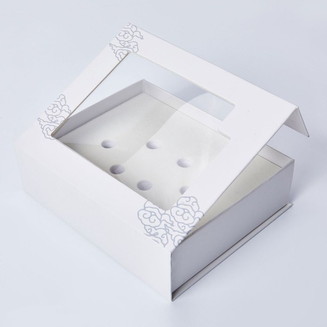 Retail packaging boxes for fitness bands arranged on a bench