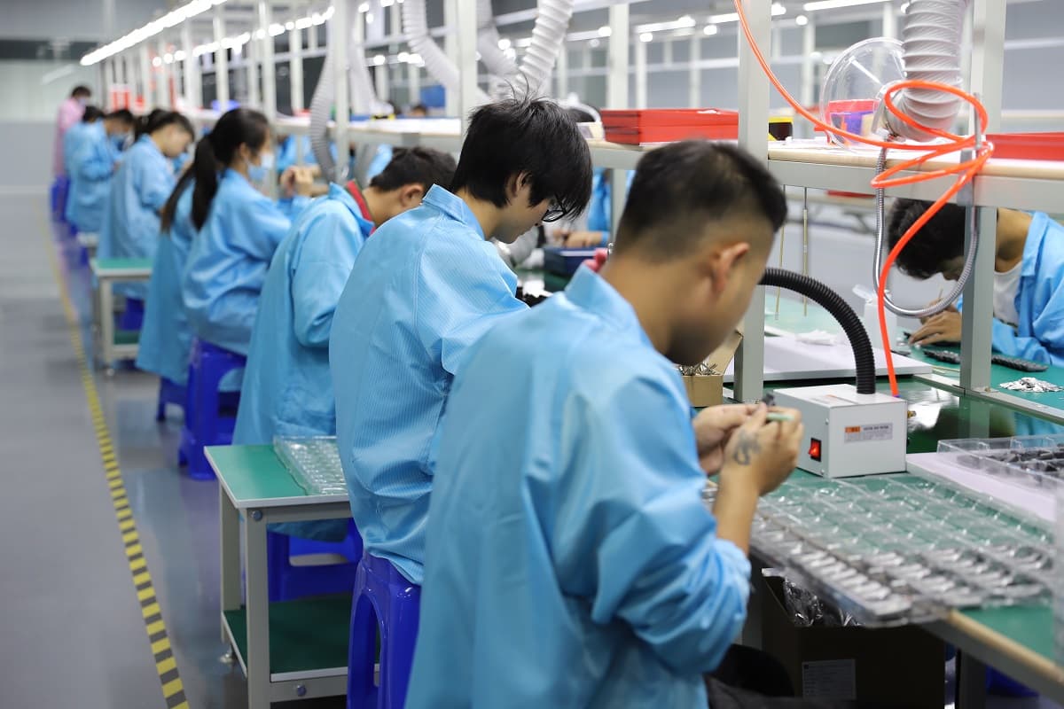 Fitness bands in production trays on the assembly line
