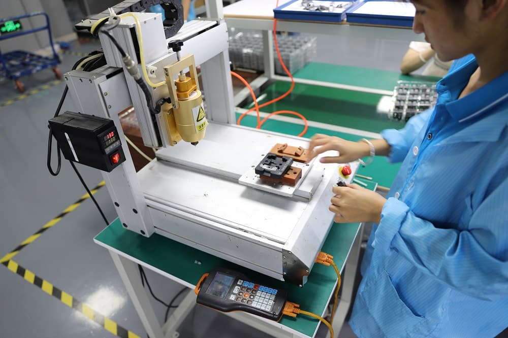 Smart watches in production trays during assembly